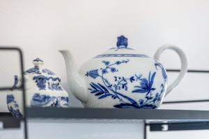 two blue and white vases sitting on a shelf at Friesenstube in Kerken