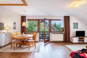 a kitchen and dining room with a table and chairs at Ferienhaus Völkle in Hinterzarten