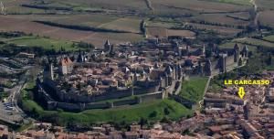 an aerial view of a city with a castle at Gîte Carcasso in Carcassonne