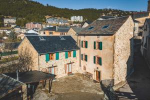 an aerial view of a city with buildings at Le Cottage des Pléiades in Les Angles