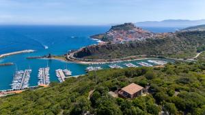 an aerial view of a harbor with boats in the water at Hakéyah in Castelsardo