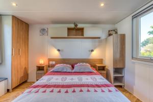 a bedroom with a large bed and a window at Le 370 Lattes in Lattes +21 photos