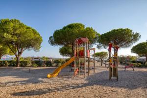 a playground with a slide in a park at Le 370 Lattes in Lattes