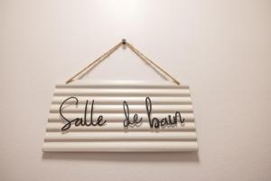 a sign that reads silk do beauty hanging on a wall at Les chalets du Praz 4 - Immoclean in Morillon