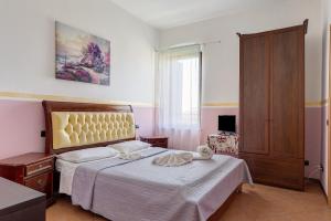 a bedroom with a bed and a large window at B and B 7 Camini in Verona