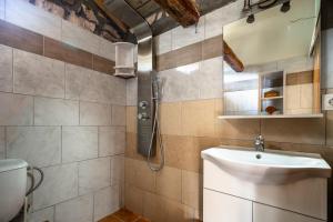 a bathroom with a sink and a shower at Villa Nikos in Kefallonia +10 photos