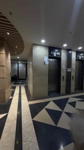 a lobby with elevators in a building at Skyline suites in Noida