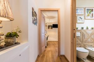 a bathroom with a toilet and a sink at Wellness Lodge Diletta in Santa Giuliana +24 photos