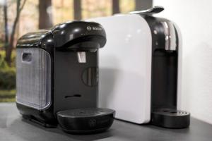 a coffee maker and a toaster sitting on a counter at Schwarzwald Chalet Achern in Achern