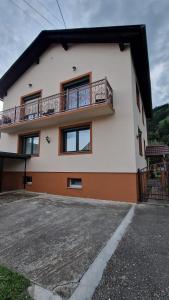 a house with a balcony on the side of it at Haus Rose in Kaisersberg