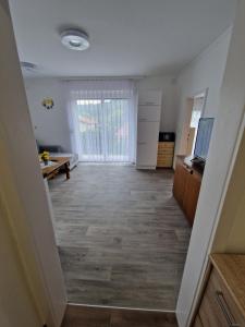 an empty room with a hallway with a living room at Haus Rose in Kaisersberg