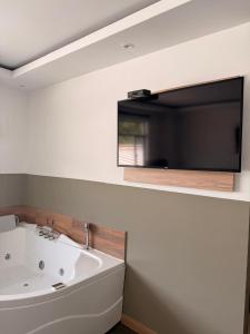 a bathroom with a white sink and a mirror at Hotel Valle de San Nicolas in Rionegro
