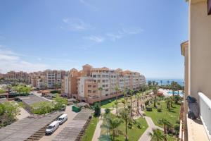 a view from the balcony of a resort with palm trees at Apartamento en Isla Canela in Ayamonte