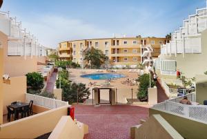 a view from the balcony of a building with a pool at Orlando 314 in Adeje