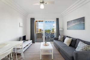 a living room with a couch and a table at Orlando 314 in Adeje