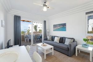 a living room with a couch and a table at Orlando 314 in Adeje