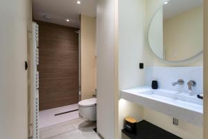 a bathroom with a sink and a toilet at Villa Ker Marie in Locquirec +19 photos