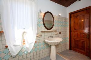 a bathroom with a sink and a mirror at Casa Euforbia in Orosei +16 photos
