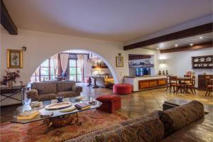 a living room with a couch and a table at Gli Archi with pool - Lecce in Lecce