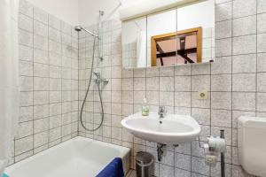 a bathroom with a sink and a toilet and a shower at Ferienhof Schülp in Schülp +45 photos