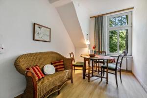 a living room with a couch and a table at Ferienhof Schülp in Schülp