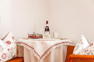 a table with a bottle of wine on it at Ferienwohnung Mengeler in Freiburg im Breisgau +11 photos