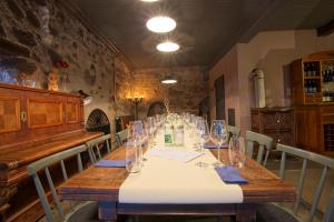 a dining room with a table with glasses on it at Fewos Weingut Pieper Basler in Offenburg