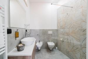 a bathroom with a sink and a toilet and a shower at Luxury 12 in Tuglie +75 photos