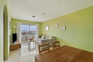 a living room with a couch and a table at Apartamento Sol Paraiso in Adeje