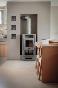 a kitchen with an oven with a stove at Gästehaus im Weingut am Stein in Würzburg