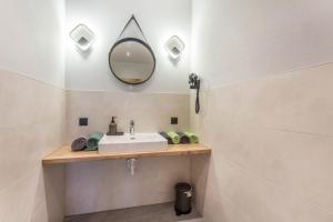 a bathroom with a sink and a mirror at Luisalle Top 2 in Auffach +18 photos