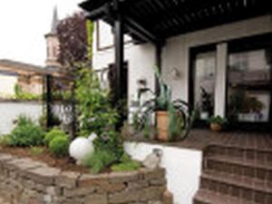 a porch of a house with plants in it at Ferienwohnung Dora Brand in Arnsberg