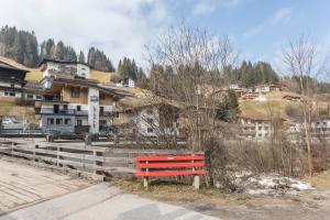 a red bench sitting on the side of a road at Luisalle Top 2 in Auffach