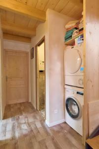 a laundry room with a washer and dryer at Charming Chalet 3 étoiles - 10 pers in Courchevel