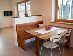 a dining room table with a bowl of fruit on it at Appartment Gut Wendlandt in Bolzano