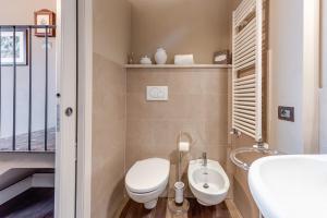 a bathroom with a toilet and a sink at Pretty Suite Firenze Fiesole in Florence