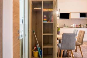 a kitchen with a table and a dining room at Apartment Annabel in Bolzano +10 photos