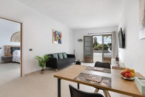 a living room with a table and a couch at Casita Lanzarote in Teguise