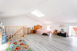 a bedroom with a bed and a crib at Gîte Koala in Marans +18 photos