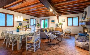 a living room with a table and a couch at Chalet du cret in Lathuile
