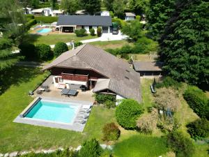 an aerial view of a house with a swimming pool at Chalet du cret in Lathuile