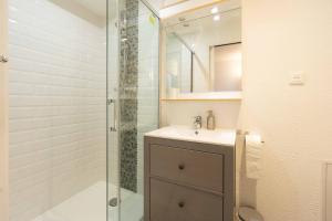 a bathroom with a sink and a shower at Chalet Belamy Studio 1 in Courchevel