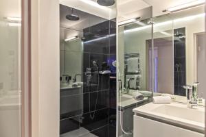 a bathroom with a glass shower and a sink at Haus Excelsior Top 38 in Seefeld in Tirol +21 photos