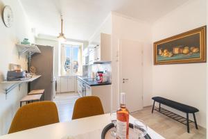 a kitchen with a table with a bottle of wine at Contessa di Corfu i in Corfu