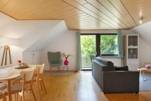 a living room with a couch and a table at Ferienwohnung Glashütte in Sankt Märgen