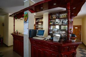 a bar with a laptop computer on top of it at Yagodina Family Hotel in Yagodina +50 photos