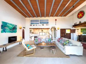 a living room with a couch and a table at Can Picca in Illes Balears