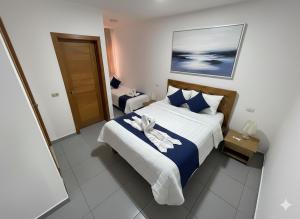 a bedroom with a bed with a towel on it at beautiful vacation Sol Caribe in Punta Cana
