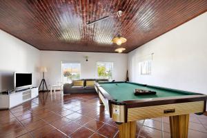 a living room with a pool table in it at Villa Oliveira in Aljezur