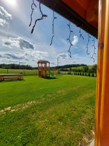 a park with a playground with a swing at Dolina Skawy in Skawa +4 photos